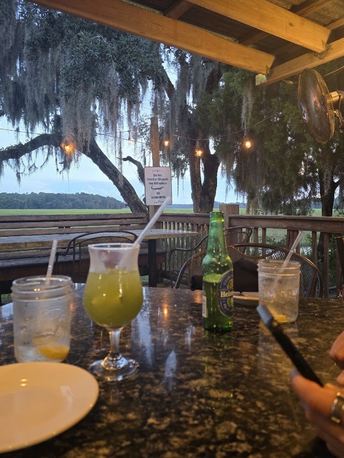 Outdoor seating beside a seafood restaurant.